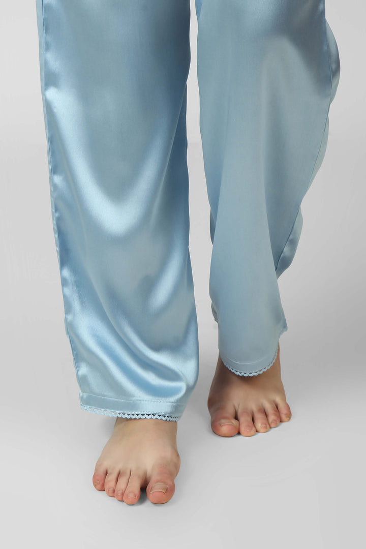 Light blue Dani Pyjama Suit with elegant satin finish and barefoot model.